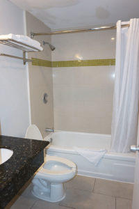 guestroom bathroom with toilet and shower